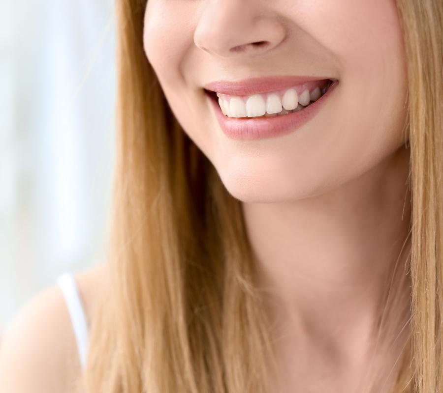 Patient smiling teeth after taking emergency dental treatment near me